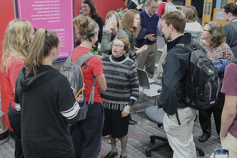 students talking to guest speaker